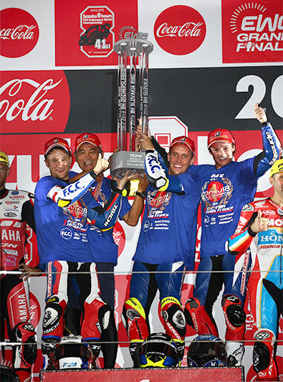 F.C.C. TSR Honda France celebrating on the podium