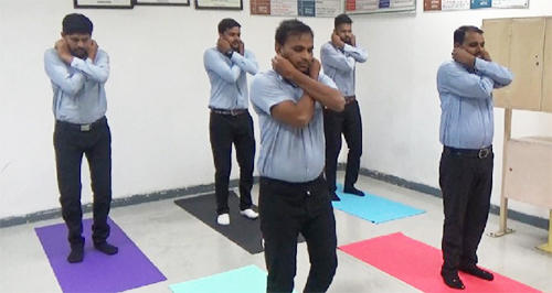 Inspectors taking part in yoga program at Bridgestone India Private Limited